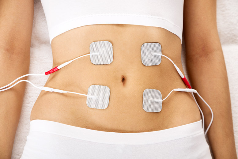High Angle View Of A Woman With Electrodes On Her Stomach